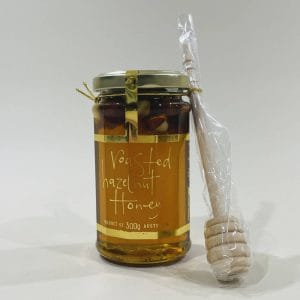 Roasted Hazelnut Honey with Dipper 300g image. Australian honey, whole roasted hazelnuts & a dash of liqueur. Online or Phone 03-5174-4888