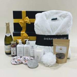 Womens Pamper Hamper image. Bathrobe, skincare, scented soy candle, choc coated macadamias, sparkling chardonnay. Online or Ph 03-5174-4888