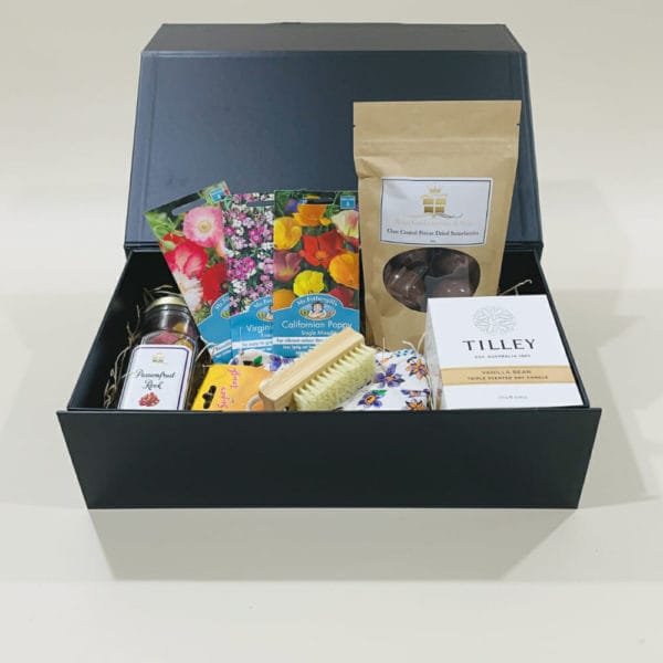 Garden Hamper image. Flowering seeds, cotton gloves, bamboo nail brush, lemongrass candle & choc coated nuts. Online or Phone: 03 5174 4888