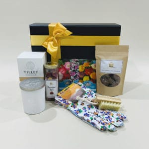 Garden Hamper image. Flowering seeds, cotton gloves, bamboo nail brush, lemongrass candle & choc coated nuts. Online or Phone: 03 5174 4888