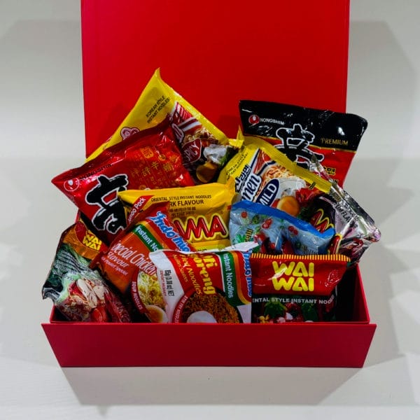'Asian Noodles Assorted Gift Box: A variety of instant noodles from Asia, beautifully presented in a golden ribboned gift box.'